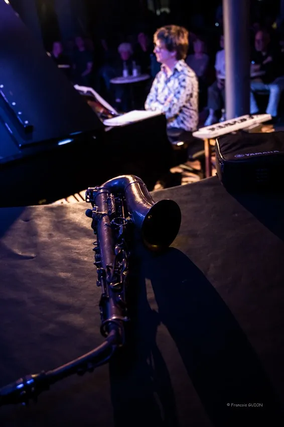 The quartet in performance, saxophone in the foreground